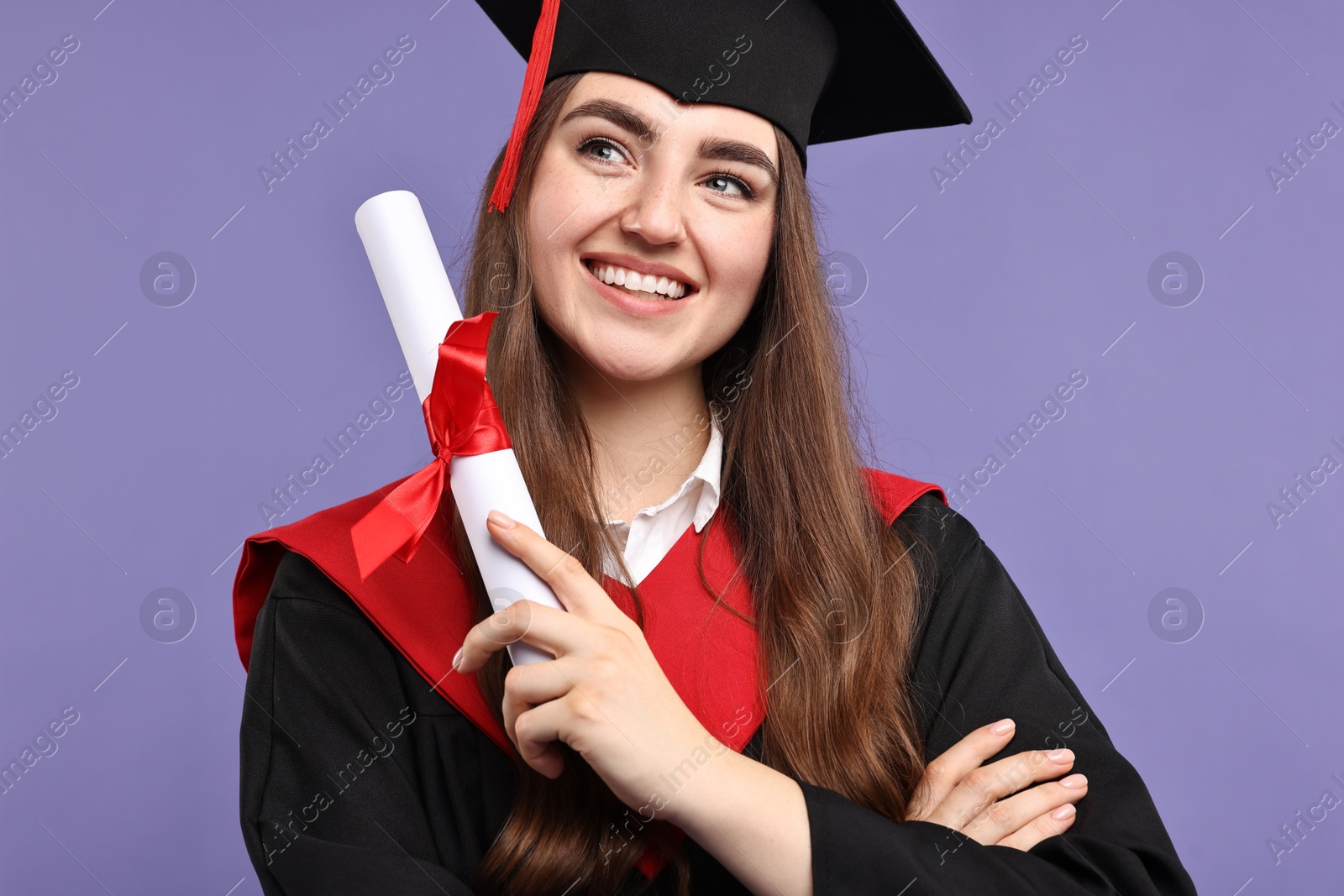 Photo of Happy student with diploma after graduation on violet background