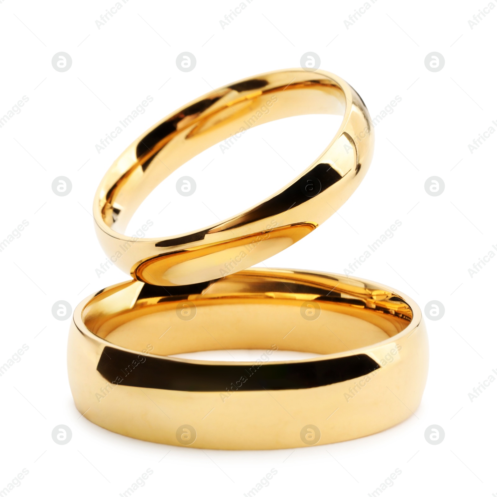 Photo of Beautiful golden wedding rings isolated on white