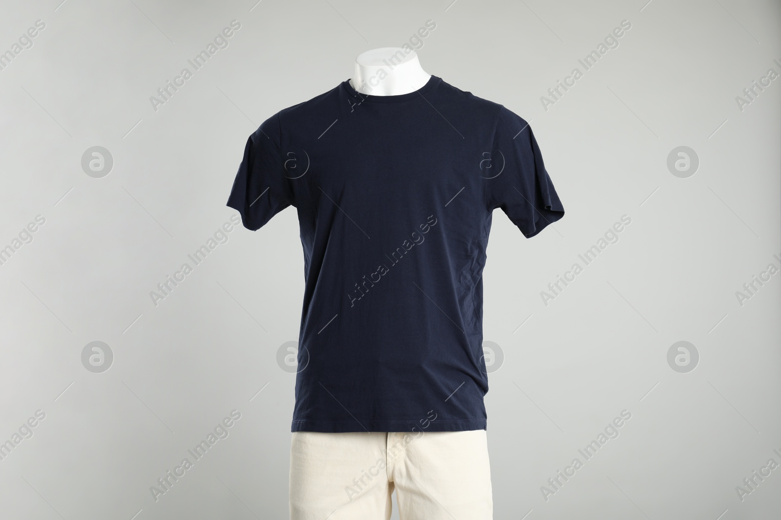 Photo of Male mannequin with stylish outfit on light grey background