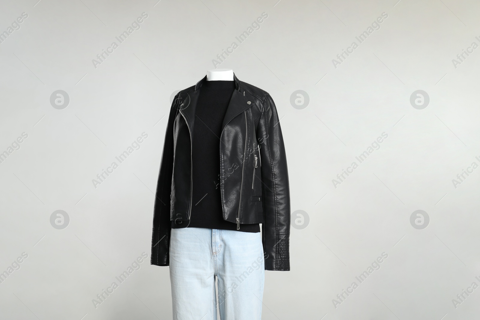 Photo of Female mannequin with stylish outfit on light grey background