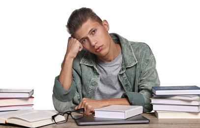 Overwhelmed student before exam at table among books against white background