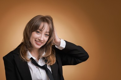 Photo of Attractive woman with stylish haircut on brown gradient background