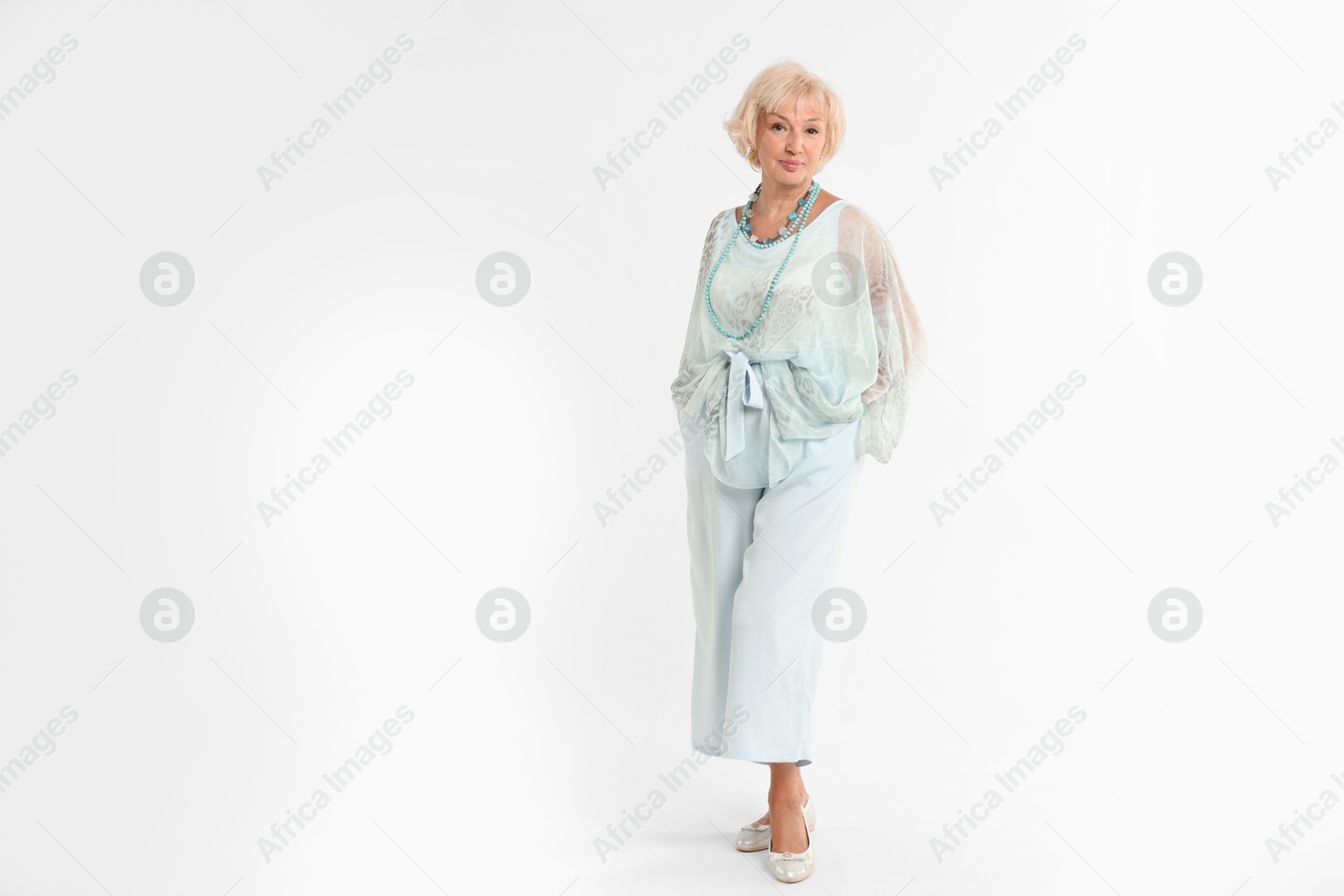 Photo of Full length portrait of beautiful senior woman on white background, space for text