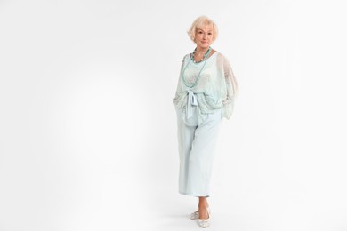 Photo of Full length portrait of beautiful senior woman on white background, space for text