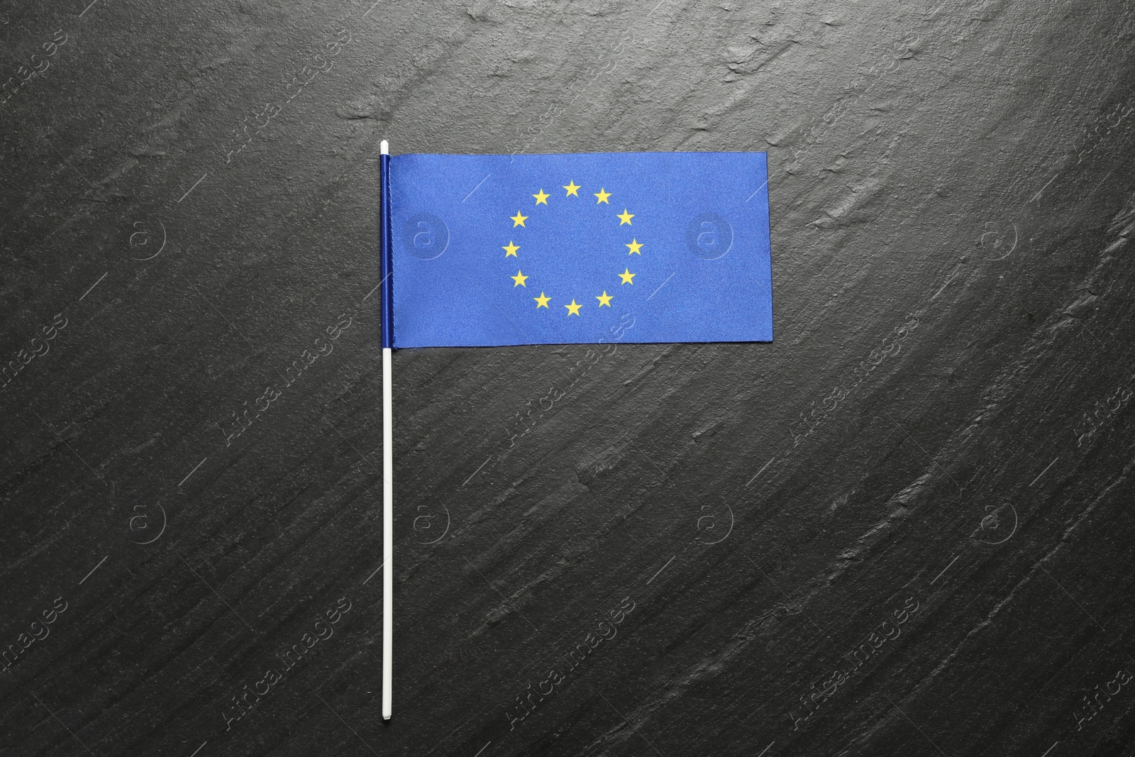 Photo of Flag of European Union on black textured background, top view