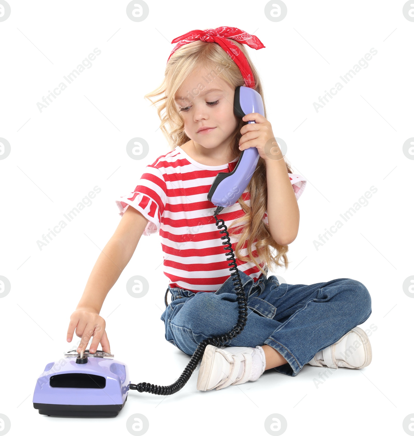 Photo of Cute little girl with telephone on white background