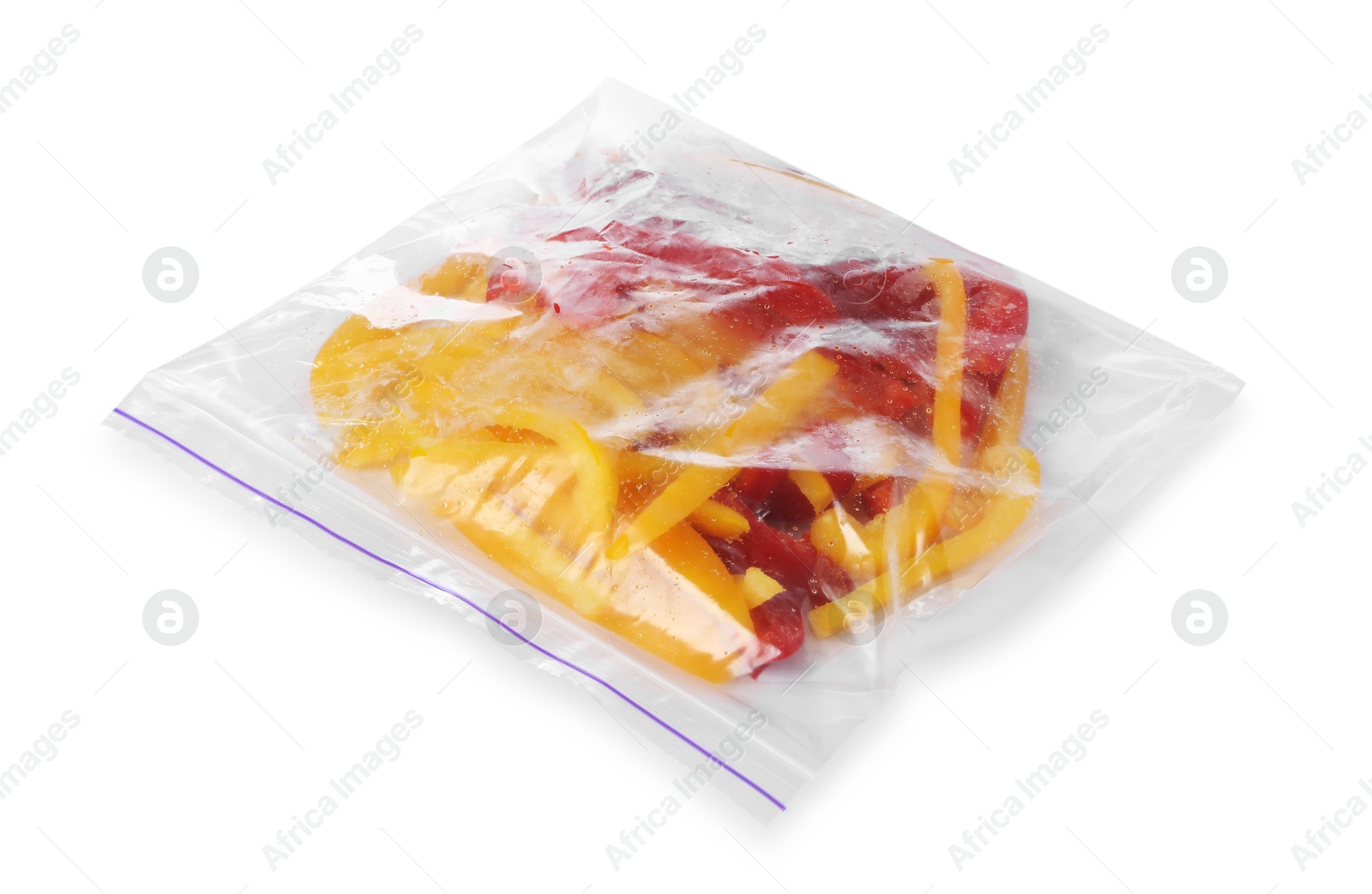 Photo of Pieces of frozen bell peppers in plastic bag isolated on white