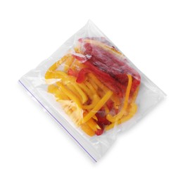 Photo of Pieces of frozen bell peppers in plastic bag isolated on white, top view