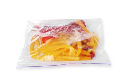 Photo of Pieces of frozen bell peppers in plastic bag isolated on white