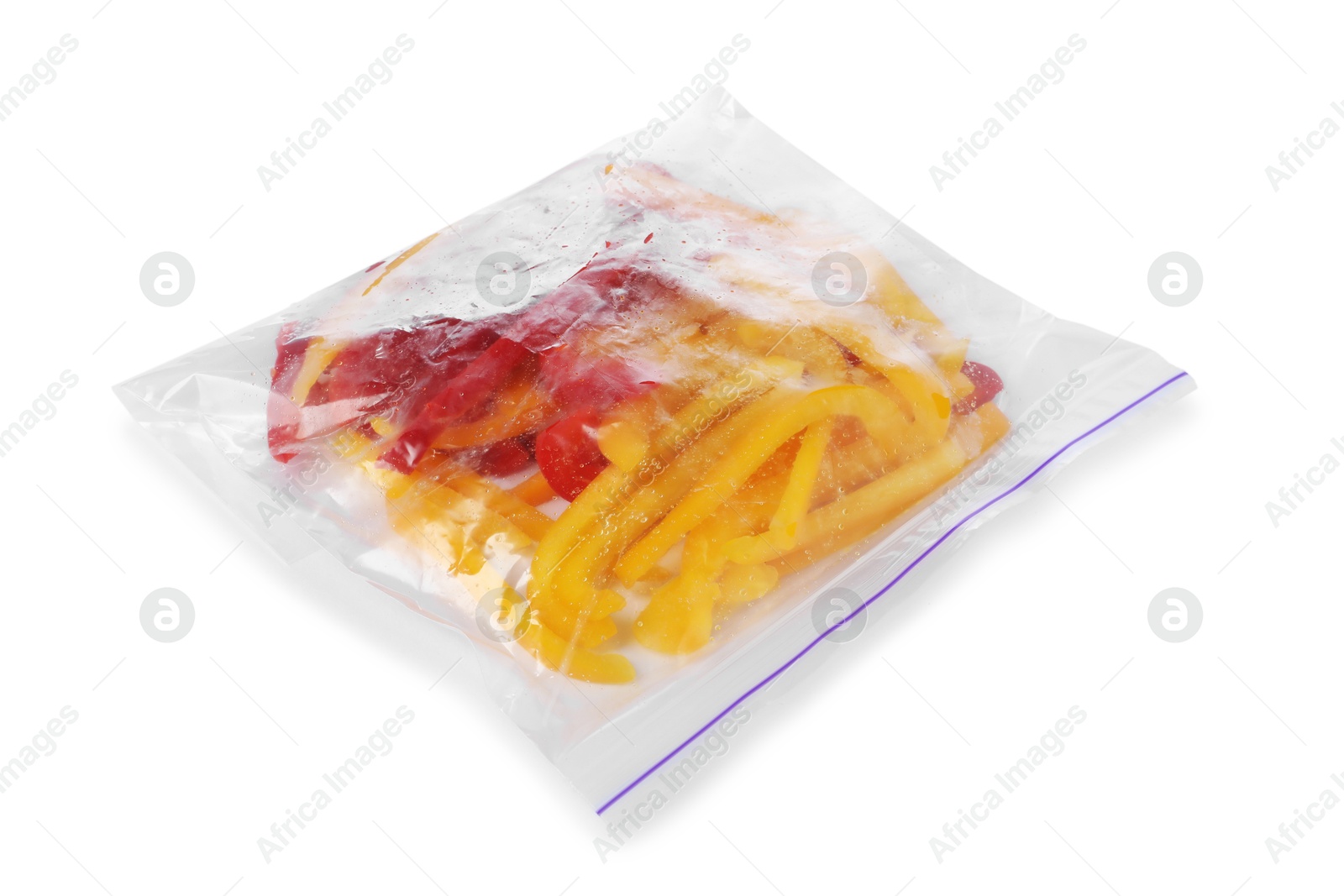 Photo of Pieces of frozen bell peppers in plastic bag isolated on white