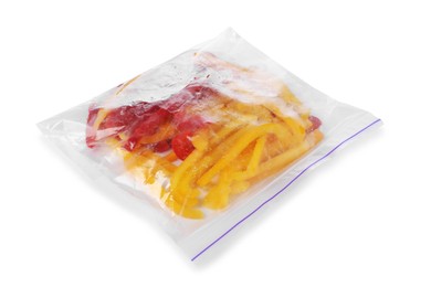 Photo of Pieces of frozen bell peppers in plastic bag isolated on white