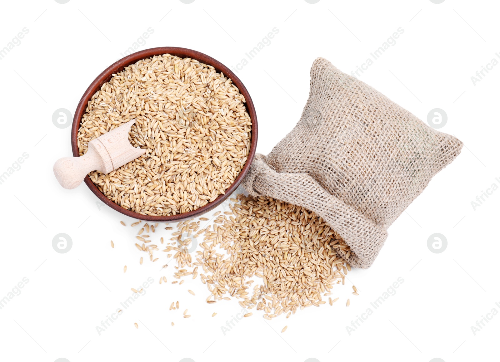 Photo of Oat grains in bowl, scoop and sack isolated on white, top view