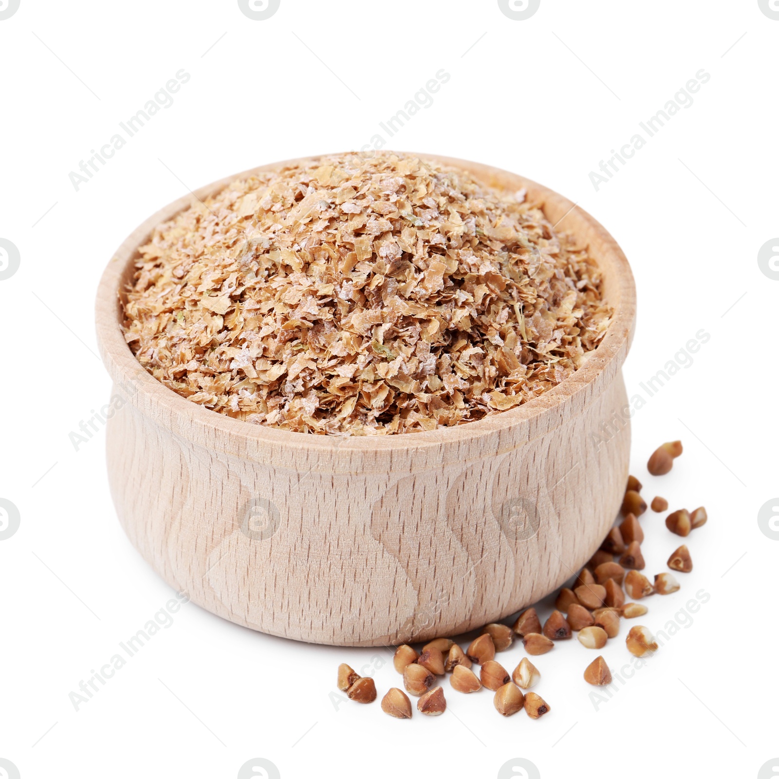 Photo of Buckwheat bran in wooden bowl and grains isolated on white