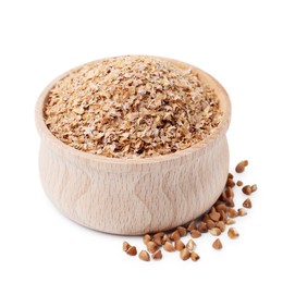 Photo of Buckwheat bran in wooden bowl and grains isolated on white