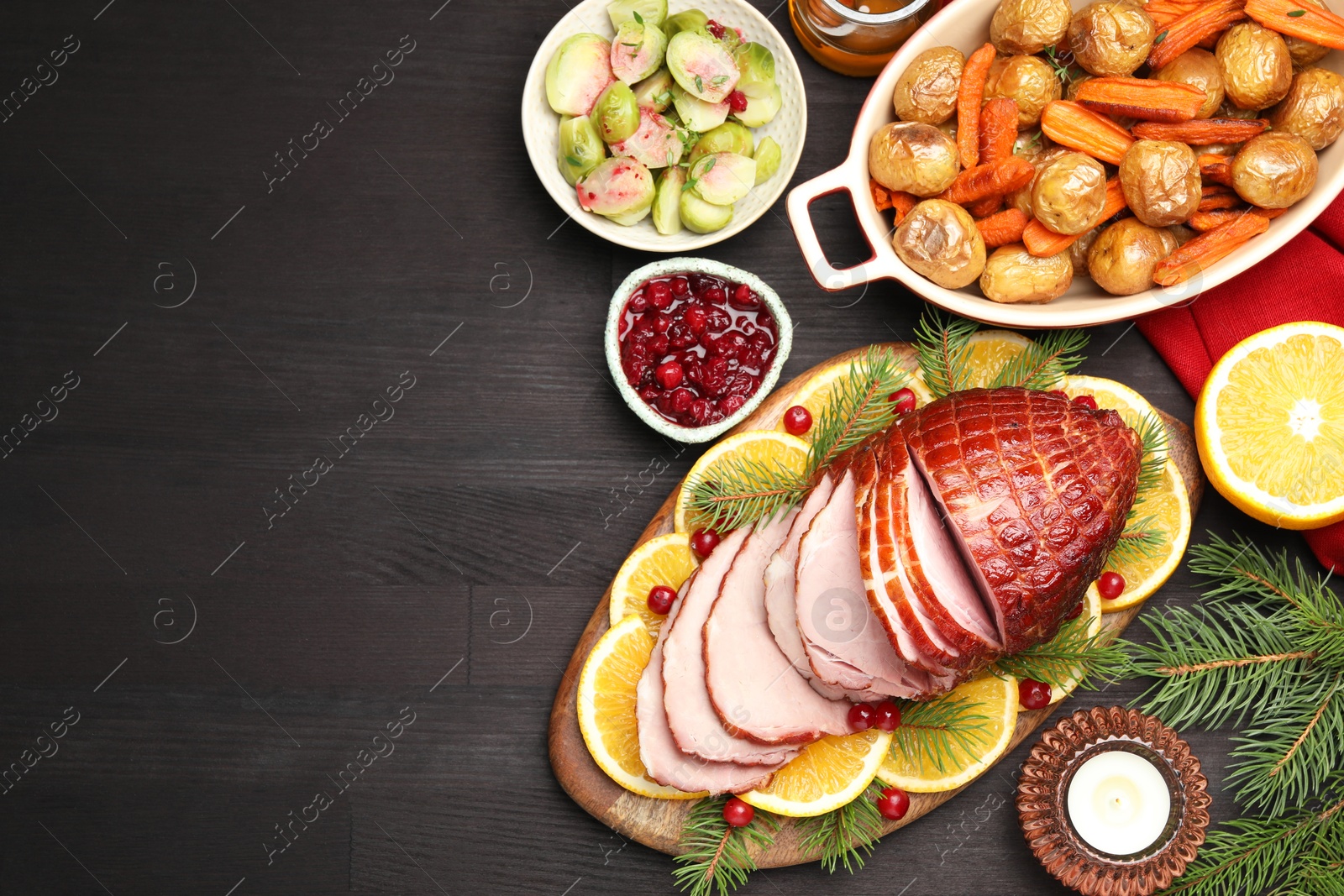 Photo of Tasty baked ham served on black wooden table, flat lay. Space for text