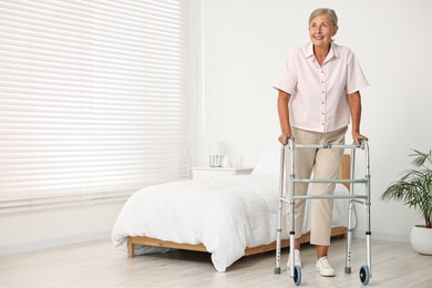 Photo of Senior woman with walking frame in hospital ward