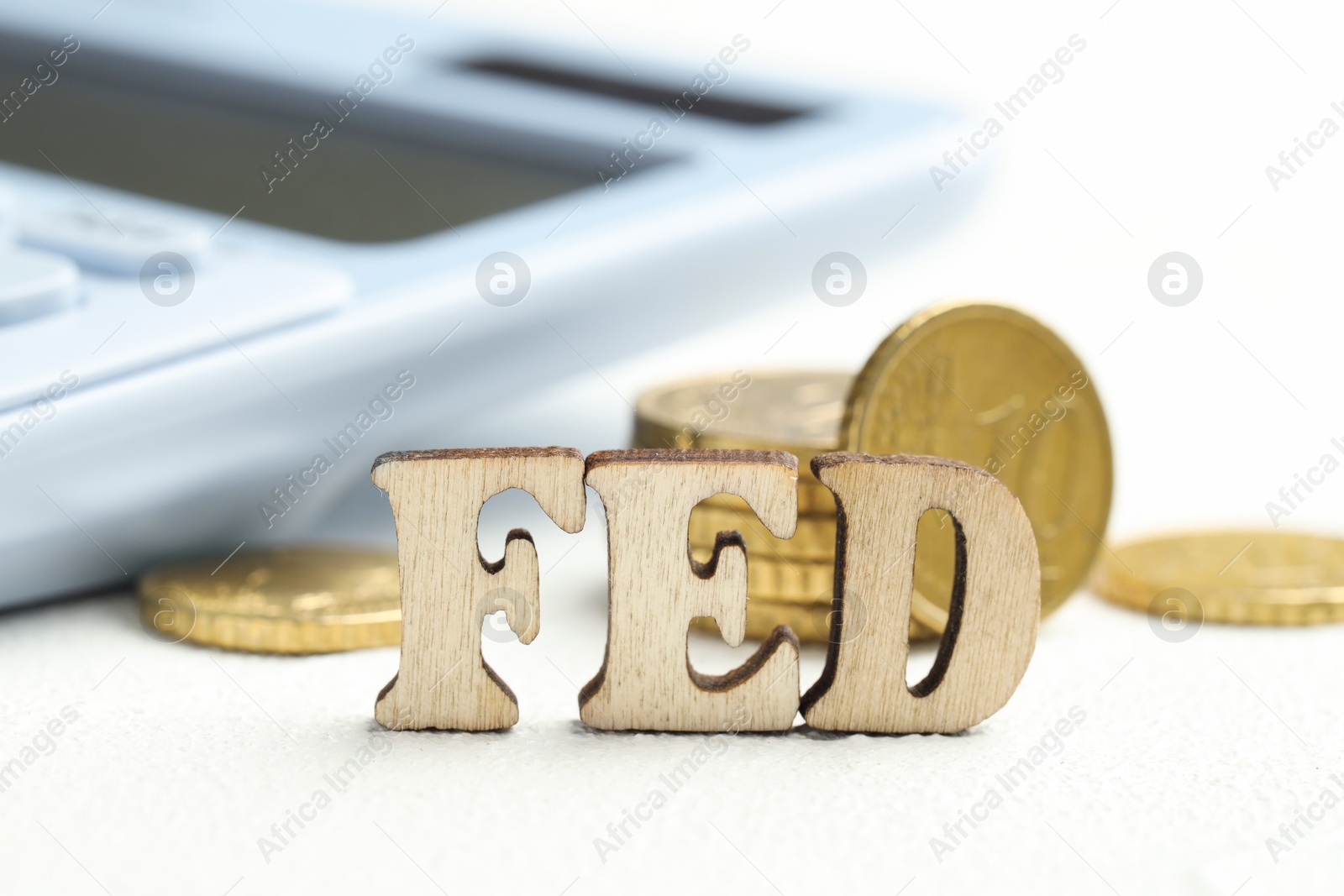 Photo of Word Fed (Federal Reserve System) made with letters and coins on wooden table