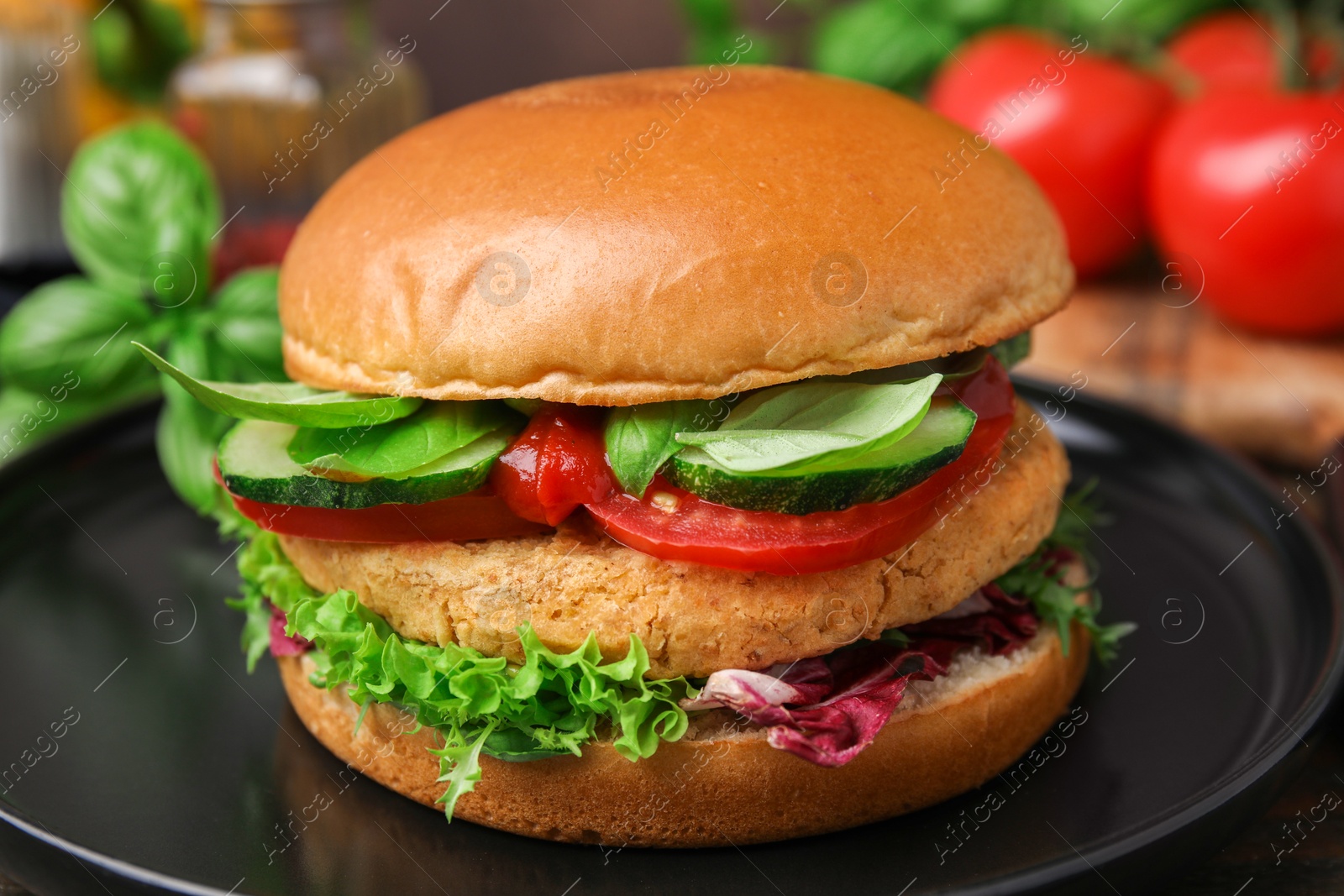 Photo of Delicious vegan burger with chickpea cutlet on wooden table, closeup