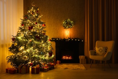 Photo of Cozy room with Christmas tree, fireplace and armchair. Interior design for holiday