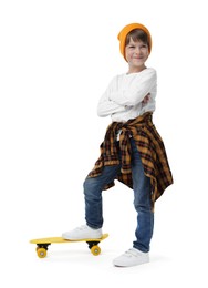 Photo of Little boy with skateboard on white background