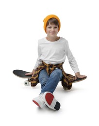 Photo of Little boy with skateboard on white background