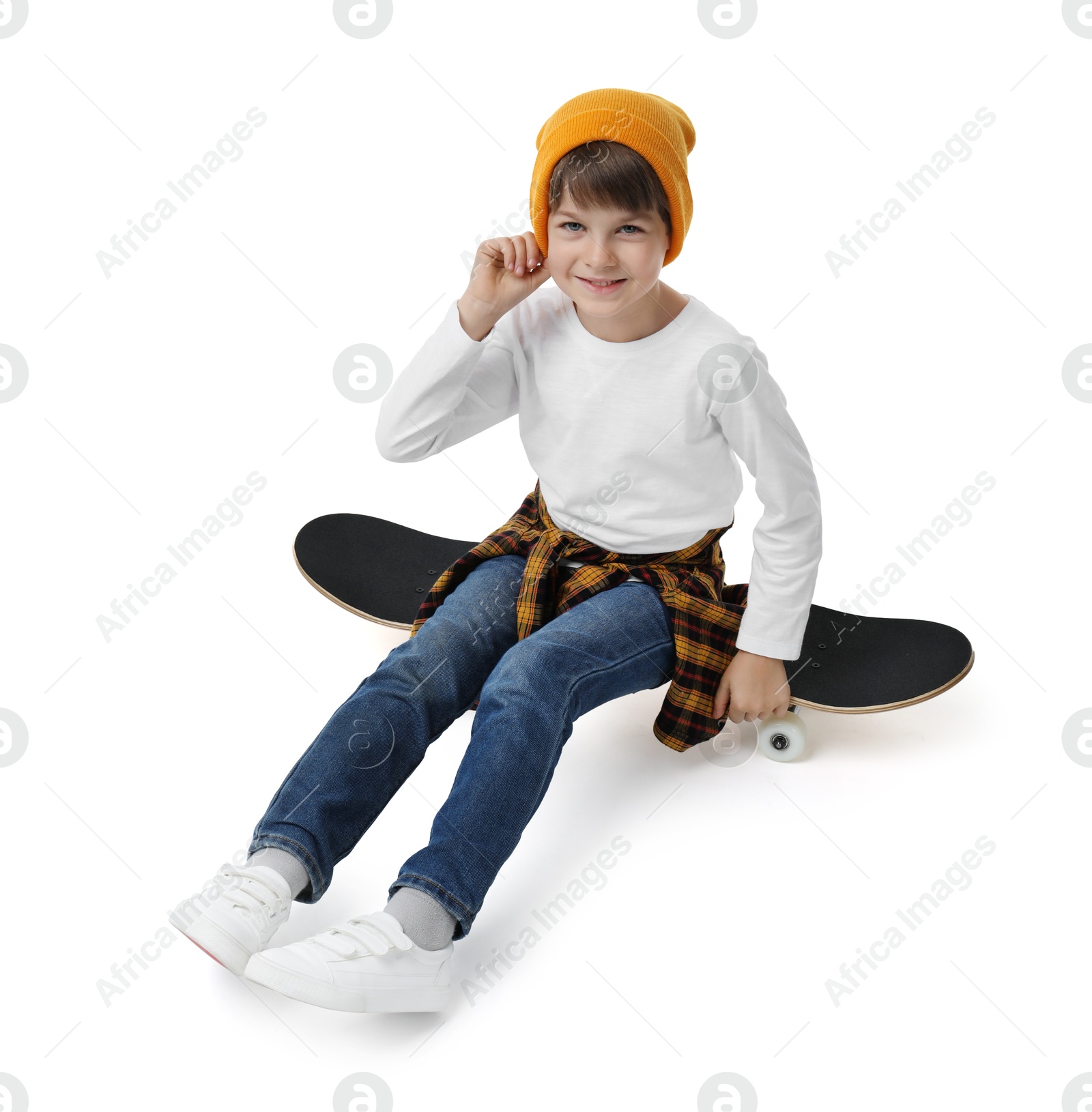 Photo of Little boy with skateboard on white background