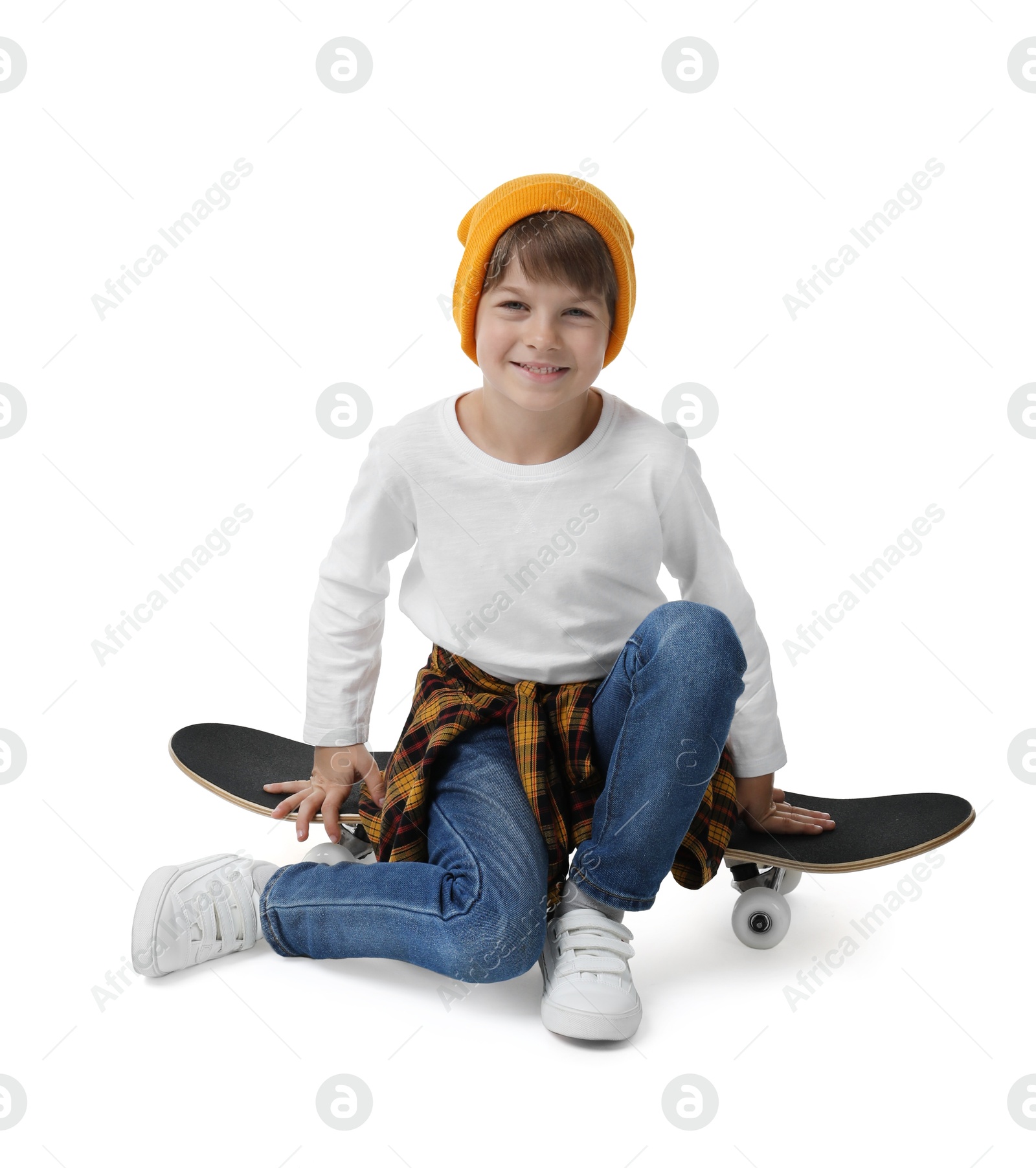 Photo of Little boy with skateboard on white background