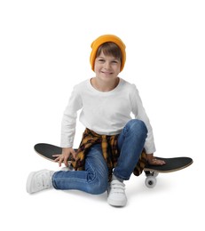 Photo of Little boy with skateboard on white background