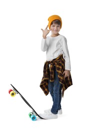 Photo of Little boy with skateboard on white background