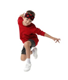 Photo of Happy little boy jumping on white background