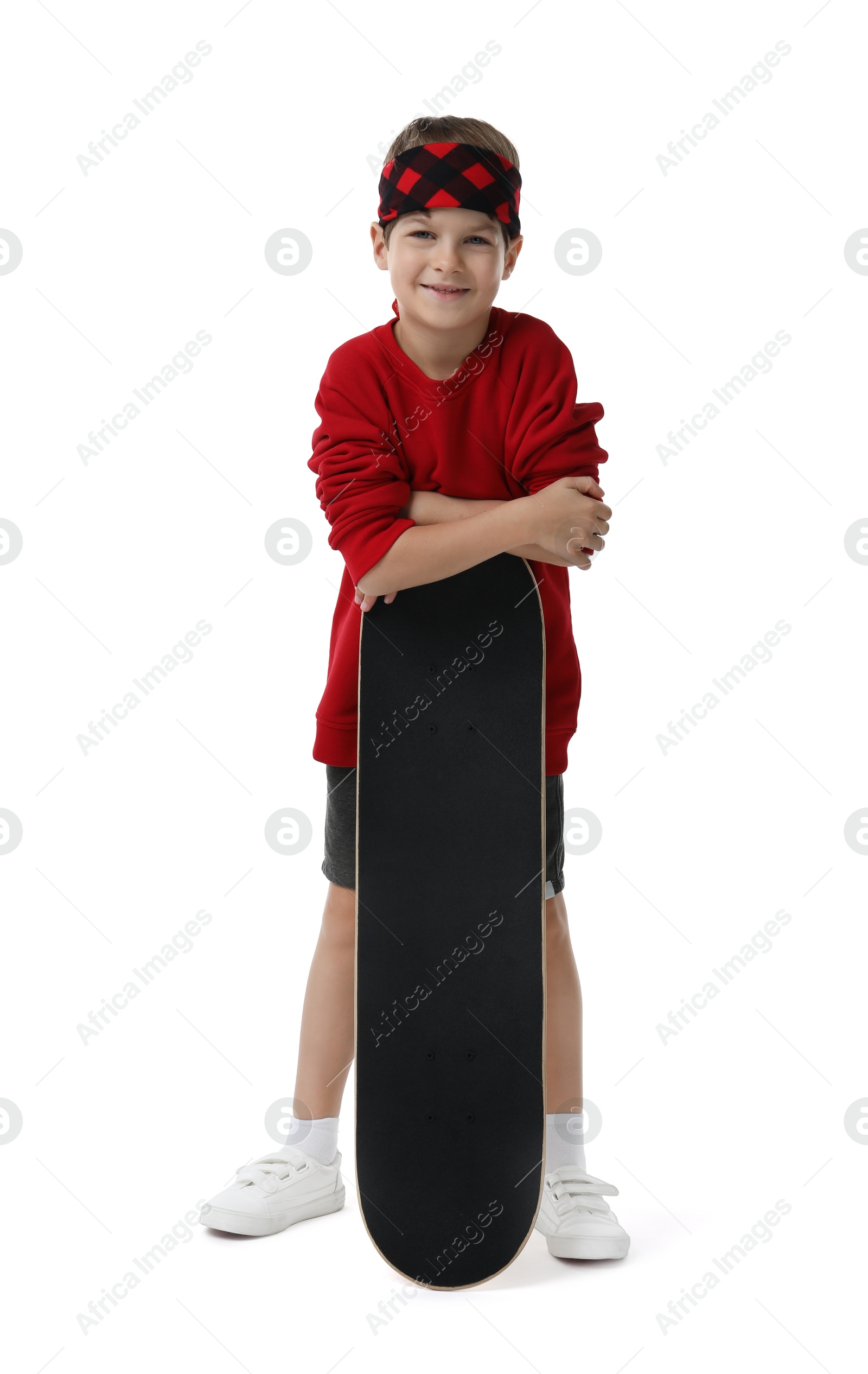 Photo of Little boy with skateboard on white background