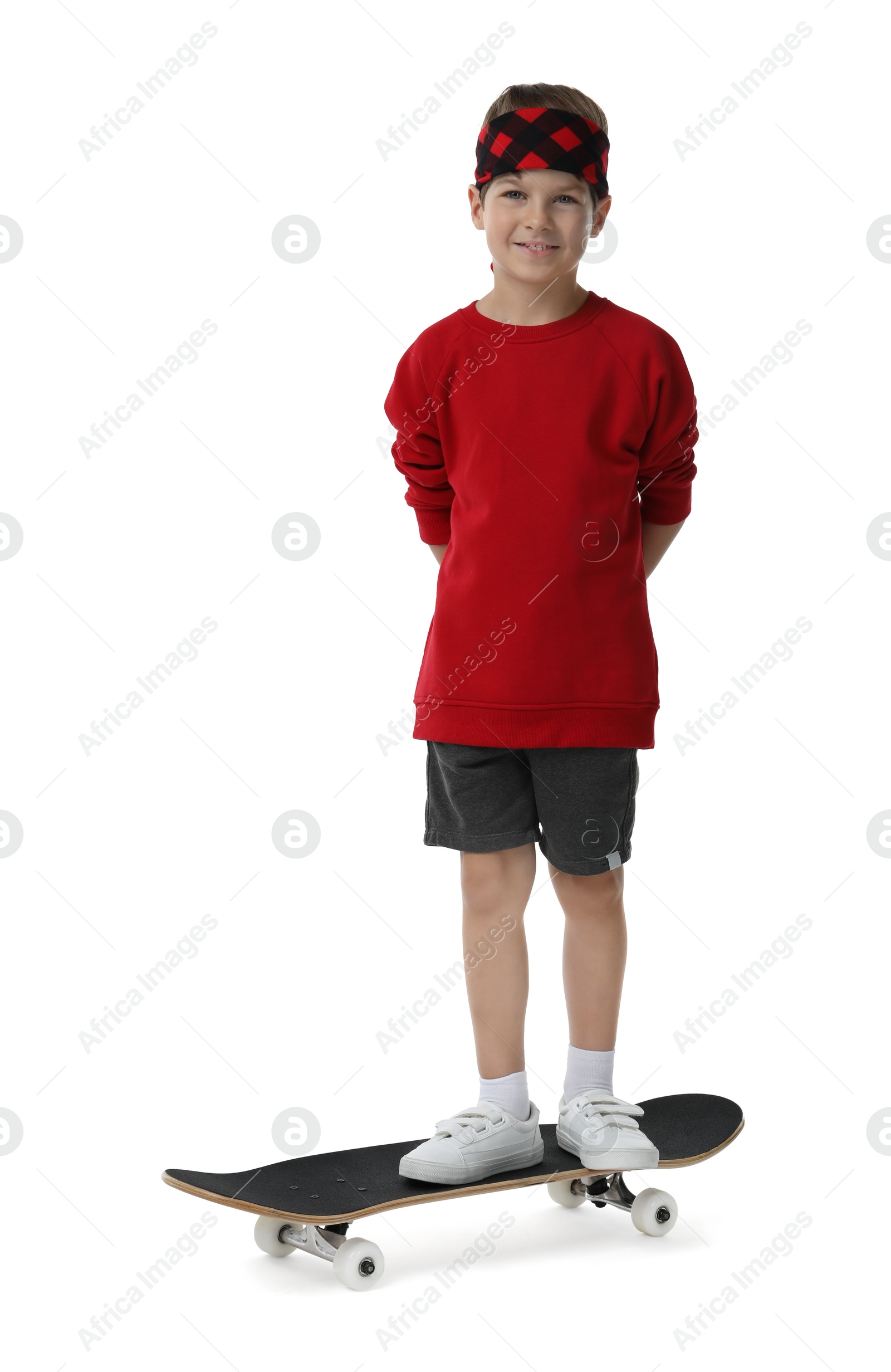 Photo of Little boy with skateboard on white background