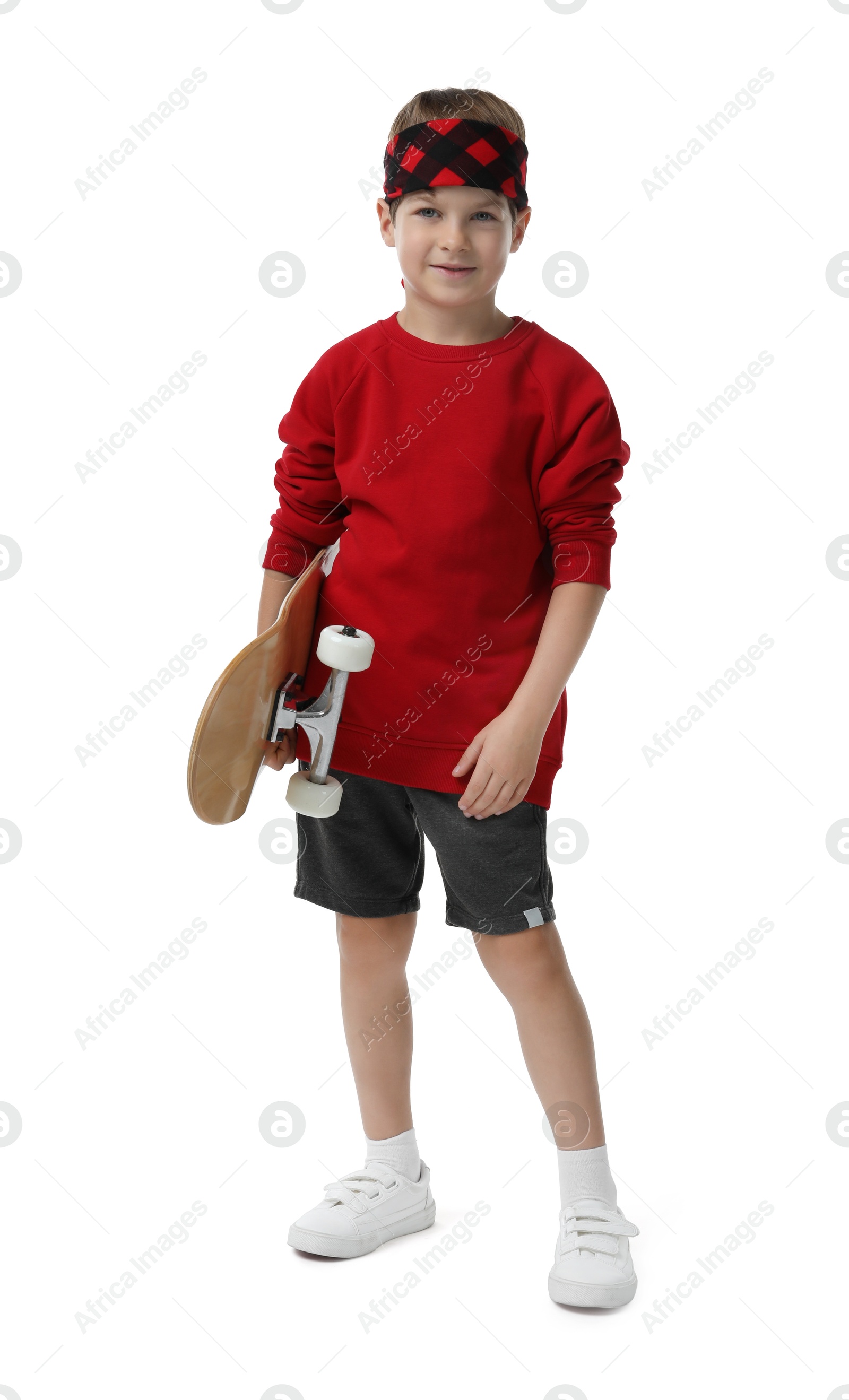 Photo of Little boy with skateboard on white background