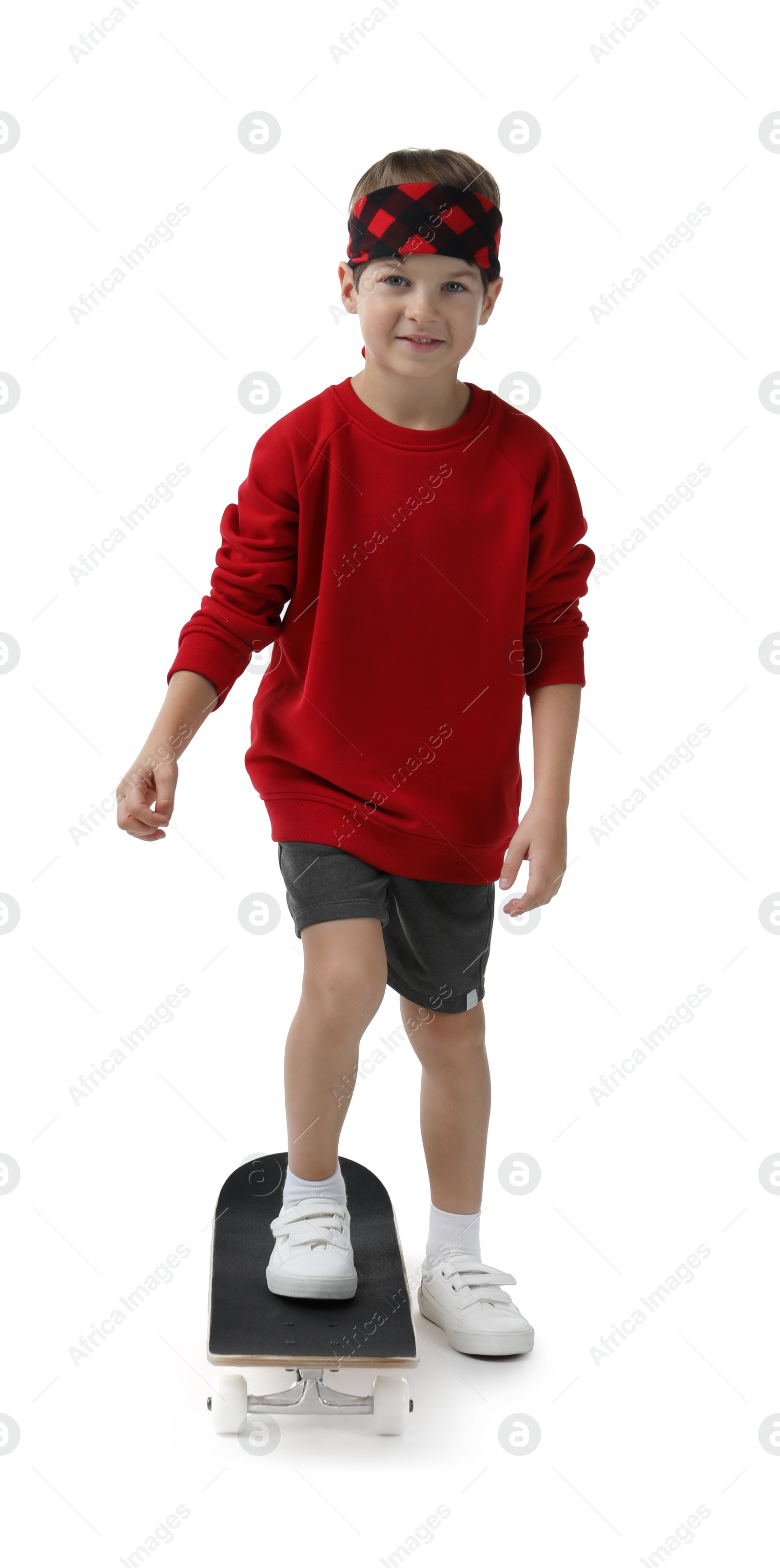 Photo of Little boy with skateboard on white background