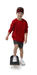 Photo of Little boy with skateboard on white background