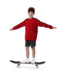 Photo of Little boy with skateboard on white background