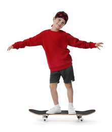 Photo of Little boy with skateboard on white background