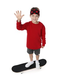 Photo of Little boy with skateboard on white background