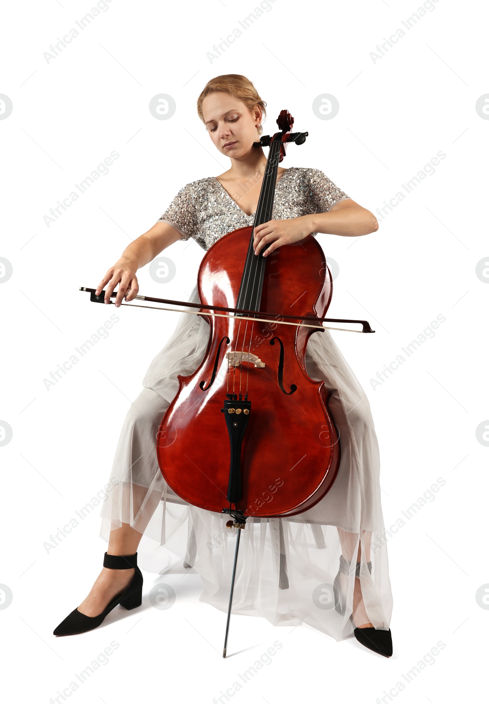 Photo of Beautiful young woman playing cello on white background