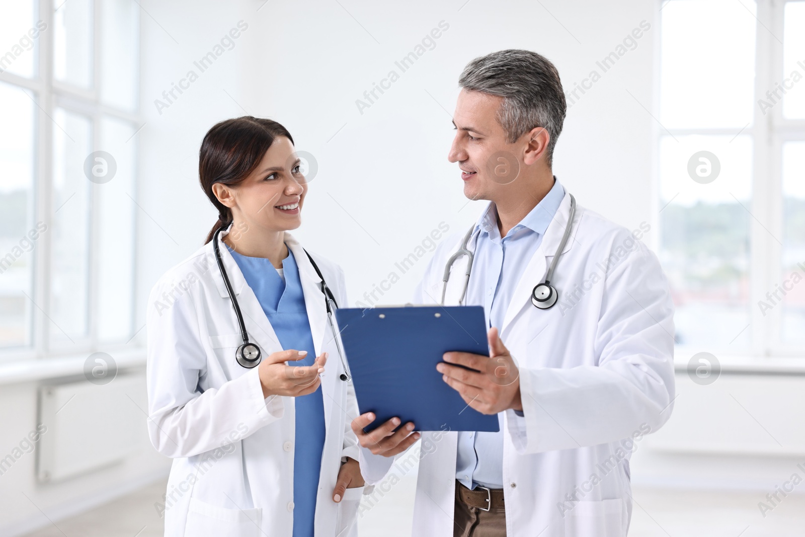 Photo of Healthcare workers talking in hospital. Medical service