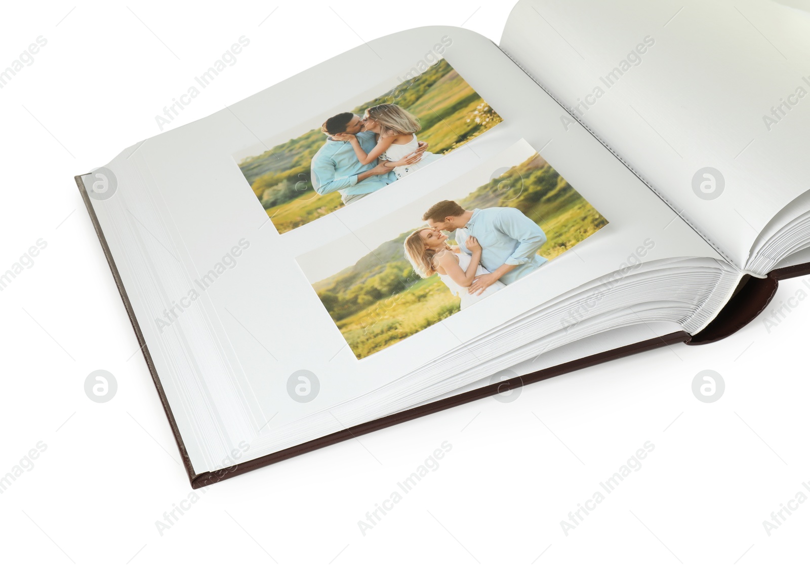 Photo of Open photo album with photos isolated on white