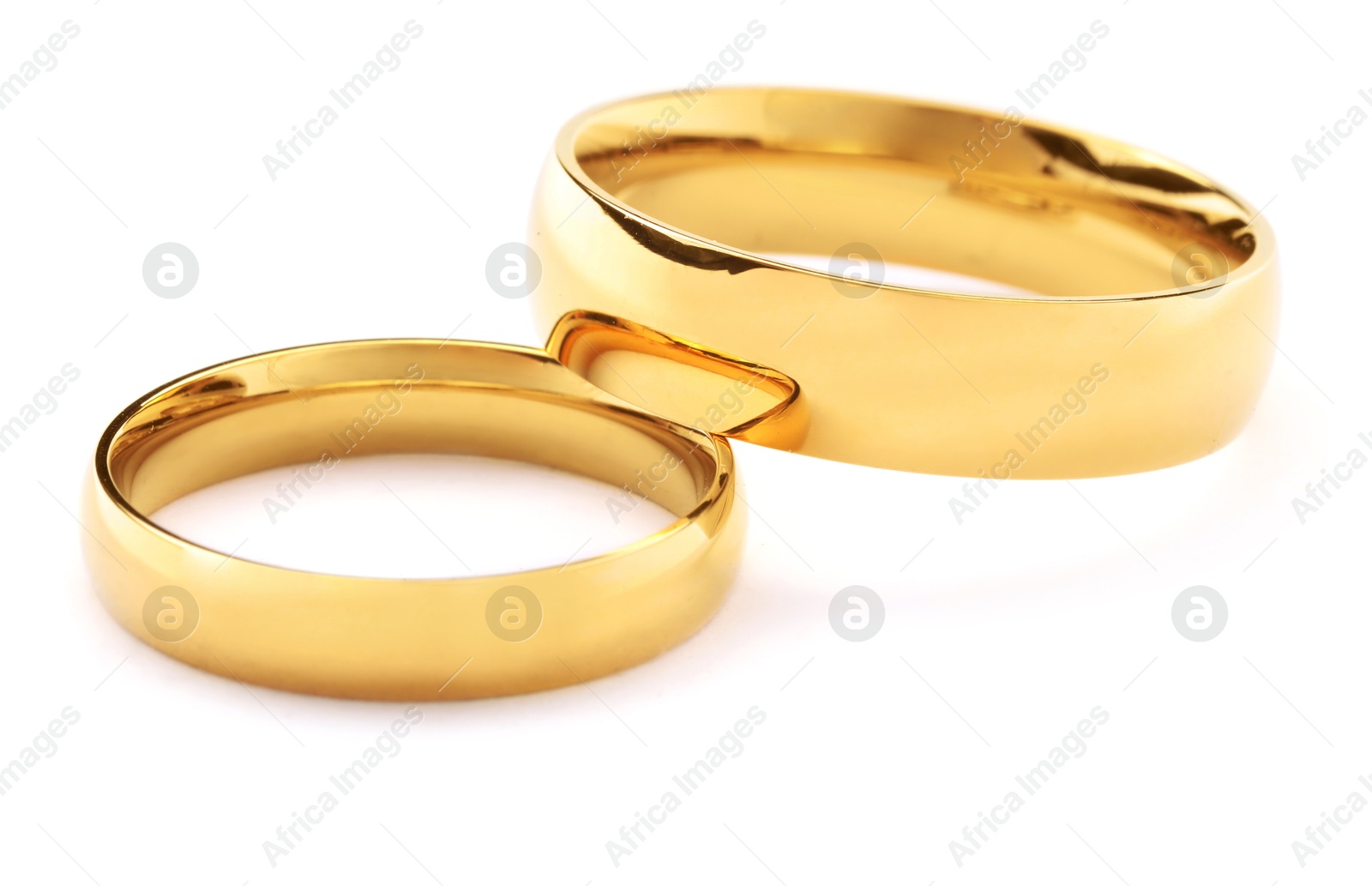 Photo of Beautiful golden wedding rings isolated on white