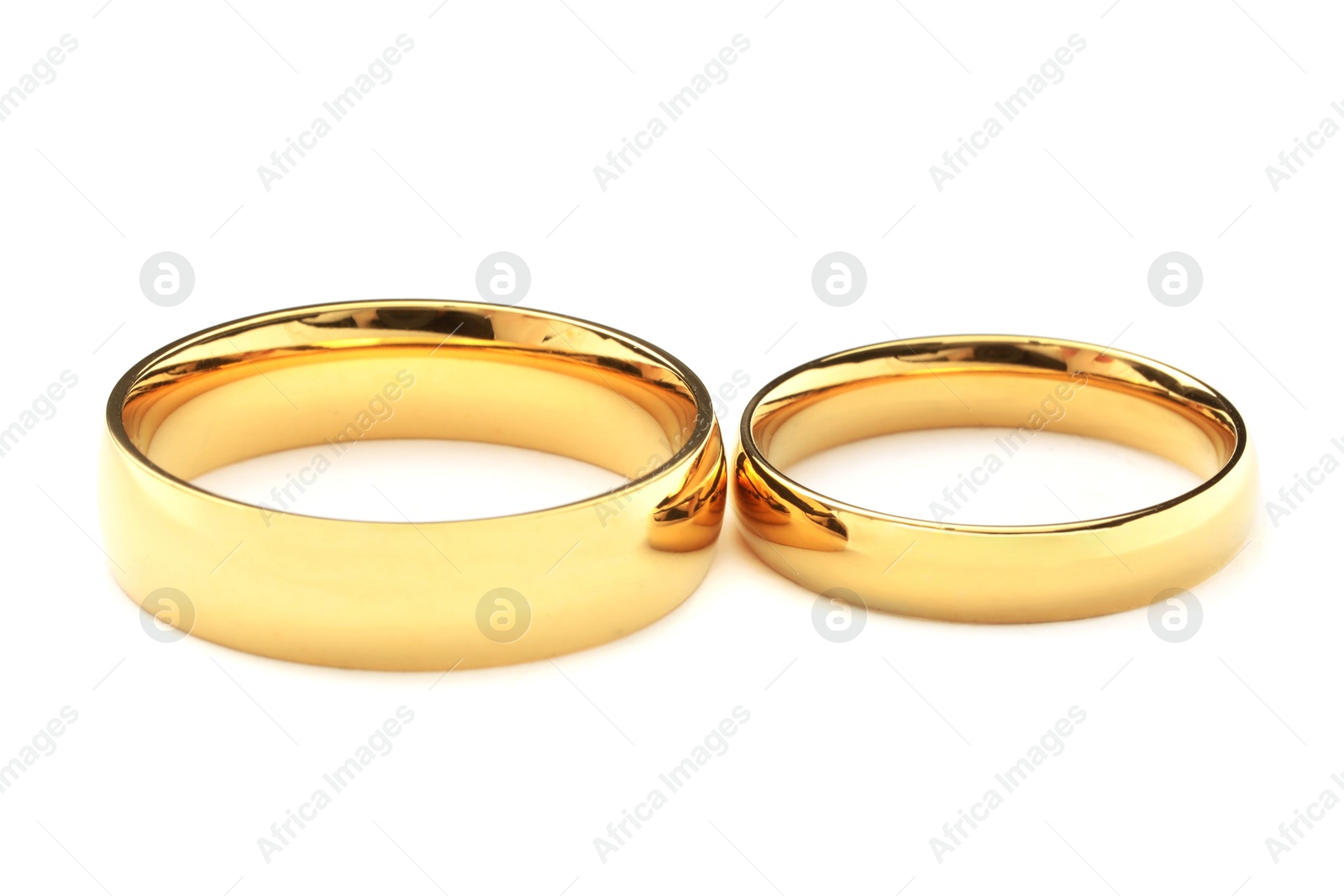 Photo of Beautiful golden wedding rings isolated on white