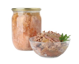 Photo of Canned meat in glass bowl, jar and parsley isolated on white