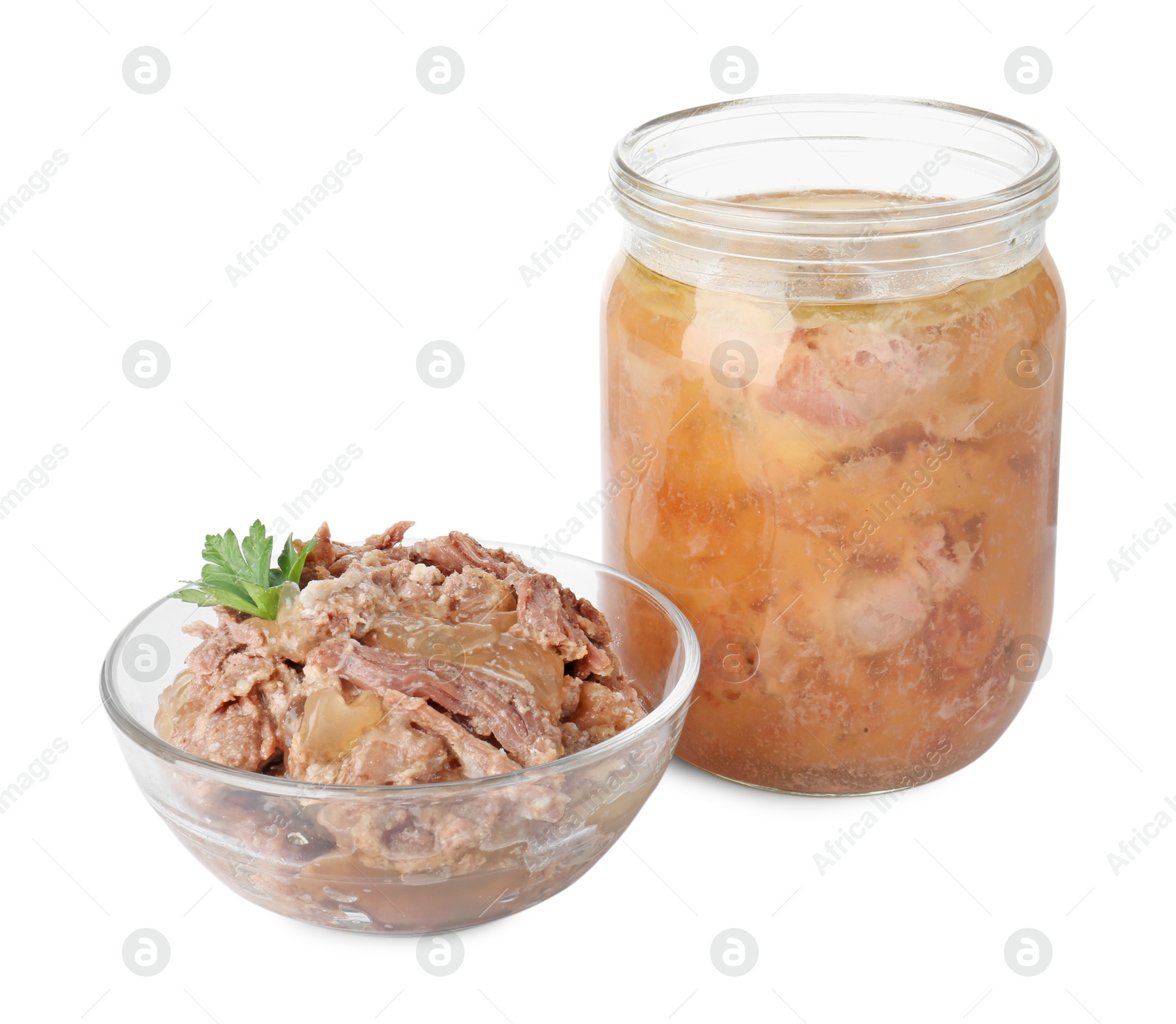 Photo of Canned meat in glass bowl, jar and parsley isolated on white