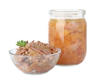 Photo of Canned meat in glass bowl, jar and parsley isolated on white