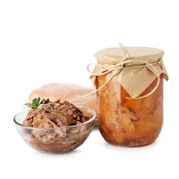 Photo of Canned meat in glass bowl, jar and raw chicken fillet isolated on white