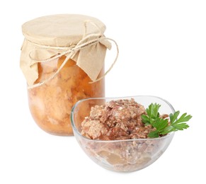 Photo of Canned meat in glass bowl, jar and parsley isolated on white