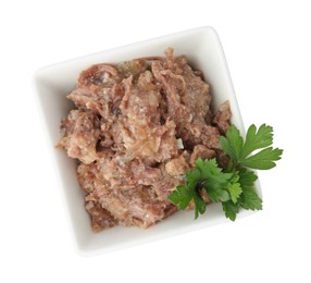 Photo of Canned meat and parsley in bowl isolated on white, top view