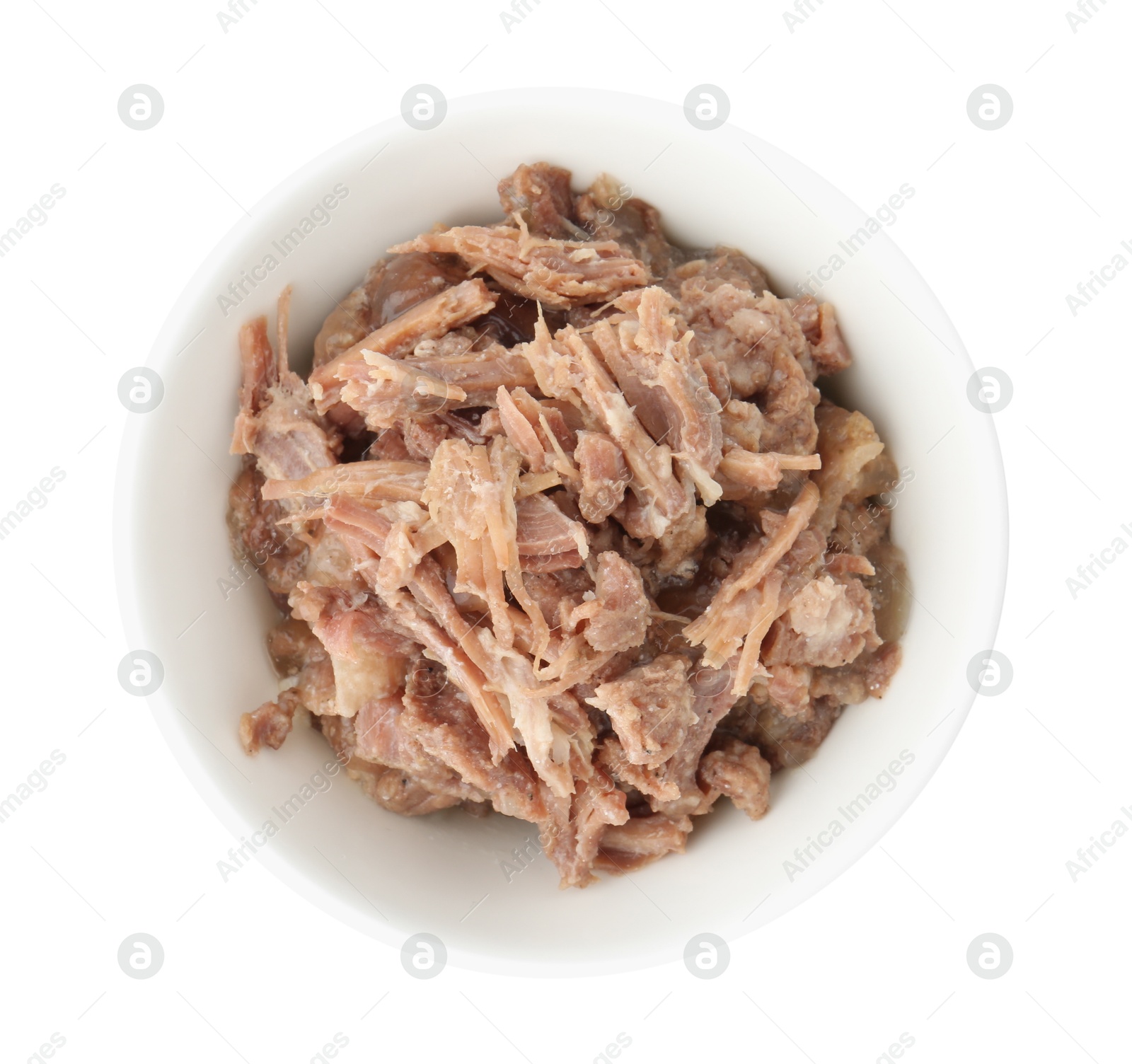 Photo of Canned meat in bowl isolated on white, top view